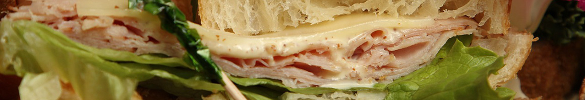 Eating Sandwich at Cheesetique Del Ray restaurant in Alexandria, VA.